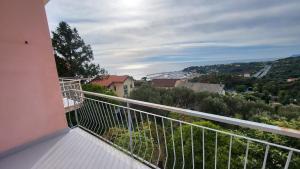 a balcony with a view of a city at Vista dai pini in Varazze