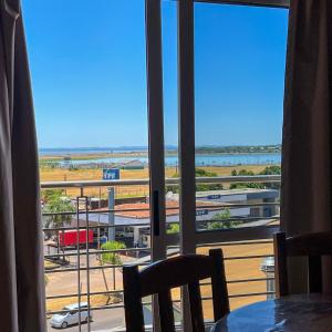 a view from a room with a table and a window at Urunday Apart Hotel in Posadas