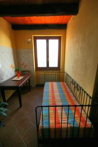 Łóżko lub łóżka w pokoju w obiekcie Azienda Agrituristica Alcastlè