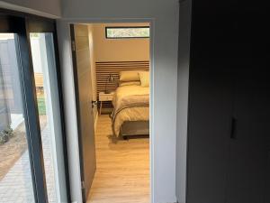a bedroom with a bed in a room with a window at Alicante in Worcester