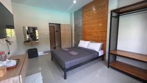 a small bedroom with a bed and a mirror at Buathong Pool Villa in Ban Khung Taphao +54 photos