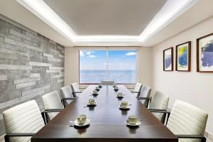 a conference room with a long table and chairs at Grand Fiesta Americana Veracruz in Veracruz +169 photos