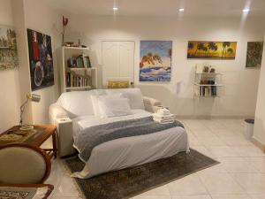 a living room with a bed and a couch at OASIS VILLA Karon Beach in Karon Beach