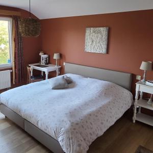 a bedroom with a large bed and two tables at Green Hill Guest Room Overijse in Overijse