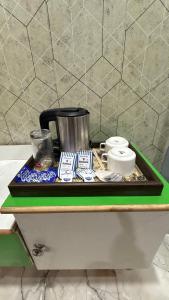 a tray on top of a counter in a room at Sneham home stay in Vrindāvan