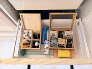 a room with two wooden shelves and food items at Hygge Hut in Vama