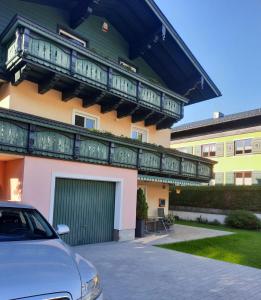 a building with a car parked in front of it at Ferienwohnung Wasserfall in Golling an der Salzach