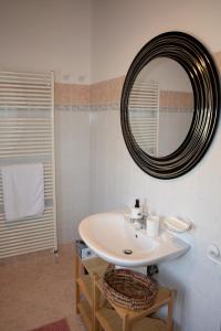 a bathroom with a sink and a mirror at A casa di Giò in Vittorio Veneto