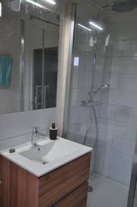 a bathroom with a sink and a shower at CEZANNe in Peynier +9 photos