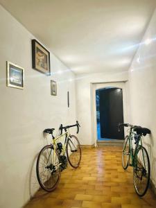 two bikes parked on a wall in a room at b&b Ergira in Cividale del Friuli