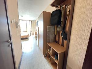a hallway of a room with a door to a room with a room at Nessebar, Studio,South Beach, Larisa in Nesebar