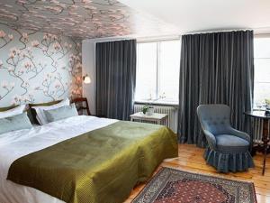 Säng eller sängar i ett rum på Hotell Villa Vesta