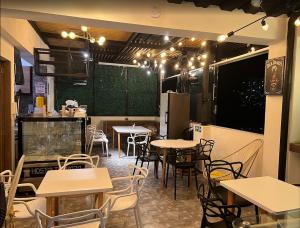 a restaurant with tables and chairs in a room at Hotel Terraza in Floridablanca