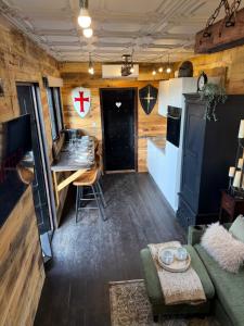 a tiny house with a kitchen and a living room at Willow Court Farm, The Copper Castle & Petting Farm, 8 min to Legoland & Windsor, 15 min to Lapland UK in Windsor