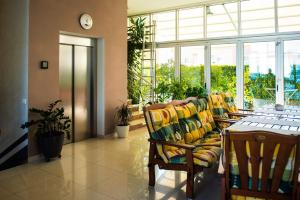 a living room with a couch and a table at Hotel Pervan in Međugorje +47 photos