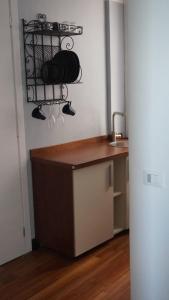 a kitchen with a counter and a sink with mugs at Porto Vecchia Darsena in Savona
