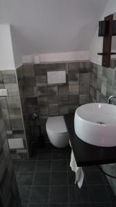 a bathroom with a sink and a toilet at Porto Vecchia Darsena in Savona