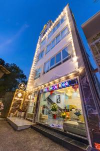 a store front of a building with lights at Nghia Lan Maison - DL Center in Da Lat