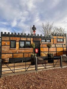 a building with a stop sign in front of it at Willow Court Farm, The Copper Castle & Petting Farm, 8 min to Legoland & Windsor, 15 min to Lapland UK in Windsor