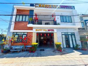 a building with a happy new year sign on it at HAPPY TEA Motel in Long Hai