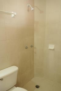 a bathroom with a shower with a toilet at Hotel Reforma in Veracruz +22 photos