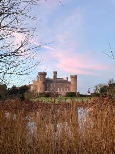 a castle sitting on top of a hill at Garden House Barmeath Castle in Grangebellew
