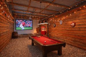 a room with a pool table and a television at Grass Roots Retreat in Llanstadwell +18 photos