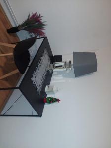 a desk with a computer and a plant on it at Apartment Fabiola Hamberg strasse 34 in Siegen in Siegen