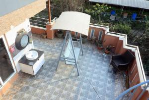 an overhead view of a patio with a sink and a mirror at New apartment in Hattigauda in Khadkagaon