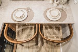 a table with chairs and plates on top of it at Filomacka Przestrzeń in Toruń +37 photos