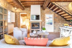 a living room with a couch and a fireplace at Chille in Capannori