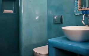 a bathroom with a sink and a toilet at Ios sea view in Ios Chora +2 photos
