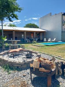 a fire pit in the yard of a house at La posadita sp in San Pedro