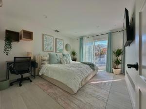 a bedroom with a bed and a desk and a window at Arlington Beach House - by Yale in West Haven