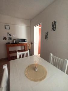 a dining room with a table with a white table cloth at Casa Serena in Munro