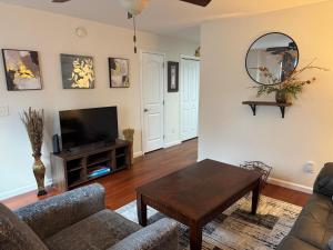 a living room with a couch and a table at Magnolia place in Cleveland