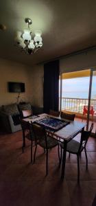 a dining room with a table and chairs with a view at Porto Sokhna Pyramids - For Families Only vip in Ain Sokhna