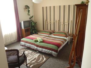 Postel nebo postele na pokoji v ubytování Hotel Green House