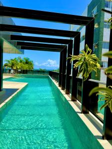 a swimming pool on the roof of a building at Refuge Beira Mar - Boa Viagem in Recife