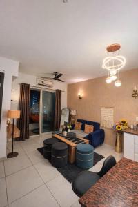 a living room with a couch and a table at Warm Embrace in Noida