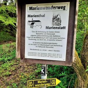 a sign for a interpretive sign at a park at Landhotel Marienthaler Hof in Marienthal +6 photos