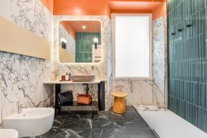 a bathroom with a tub sink and a mirror at Nessun Dorma Suite in Manarola
