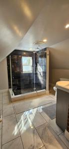 a bathroom with a glass shower in a room at The Stirton House in Shelburne +21 photos