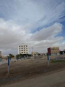 a dirt road with a building in the background at Modern Apartment Driouch 1 in Driouch