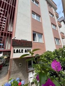 a building with a sign that reads lake art at Lale Residence in Trabzon