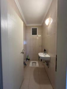 a bathroom with a toilet and a sink at Lale Residence in Trabzon