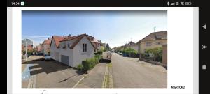 a picture of a street with a house on the road at Chambres Strasbourg in Strasbourg