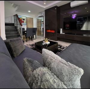 a living room with a couch and a fireplace at Luxury 3Bedroom Apartment in Sangotedo Ajah in Lekki