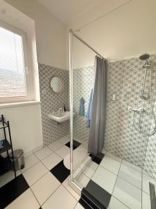 a bathroom with a shower and a sink at Panoráma apartmán Centrum in Banská Štiavnica