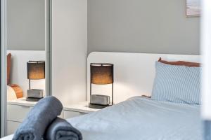 a person laying on a bed in a bedroom at Riverview Sanctuary - Walk to CBD & South Bank in Brisbane +21 photos
